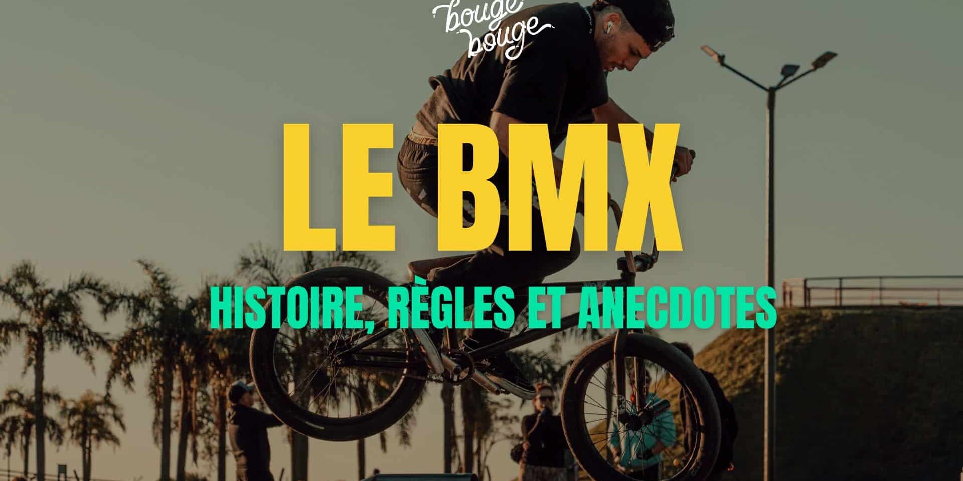 Cycliste réalisant une figure de BMX sur une piste de vélo.